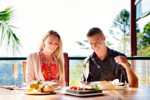 couple enjoying lunch on verandah