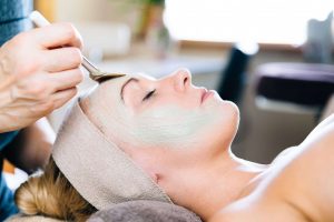 lady relaxing during facial spa treatment