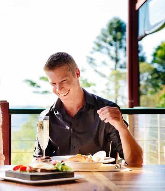 couple enjoying lunch on verandah